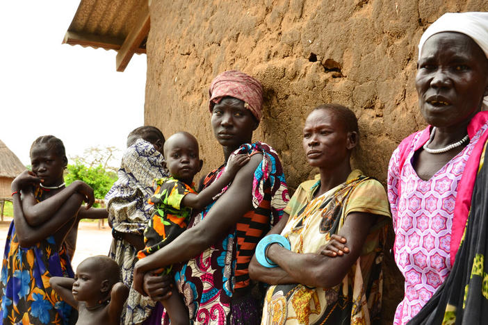 In this Wednesday Oct. 4, 2017, file photo, women and children are seen in Terekeka, South Sudan. War-torn South Sudan "should serve as an example" for other countries in the progress it is making in eradicating Guinea worm, said former U.S. President Jimmy Carter. The number of people infected with Guinea worm dropped to just over a dozen worldwide in 2021 as health workers try to eradicate the disease.
