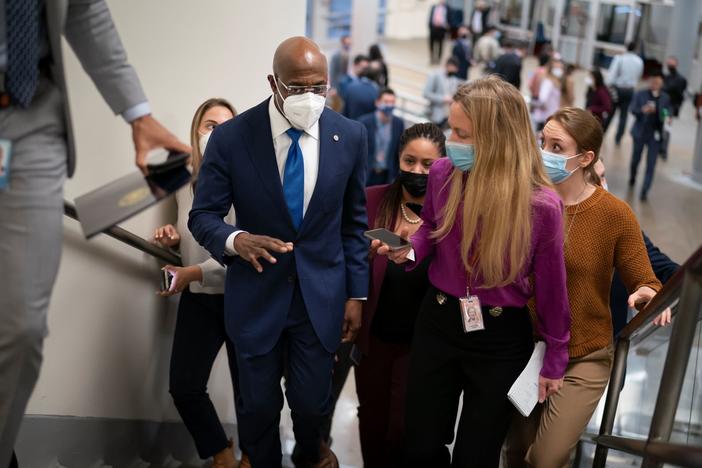 Sen. Raphael Warnock, D-Ga., arrives at the Capitol in Washington, Wednesday, Dec. 15, 2021.