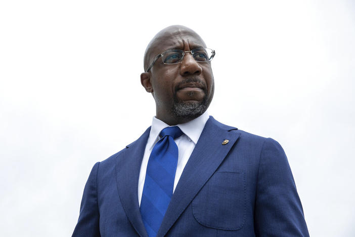 Sen. Raphael Warnock, D-Ga., speaks to reporters about voting rights legislation on Capitol Hill in Washington, Tuesday, Aug. 3, 2021. Warnock's campaign said Wednesday, Jan. 26, 2022, that he raised a hefty $9.8 million in the last quarter of 2021, nearly double the fundraising haul reported by the leading Republican contender for his seat, former football star Herschel Walker.