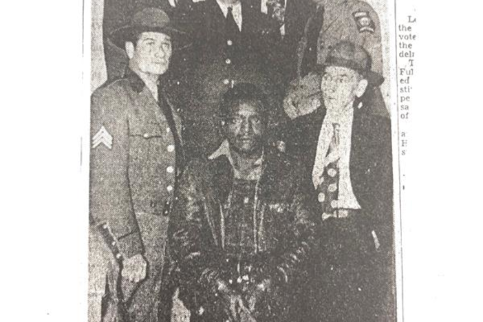 Clarence Henderson (center), apprehended in 1948 for a murder he likely did not commit.