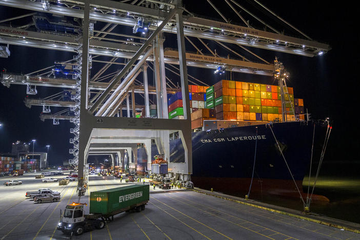 Five ship to shore cranes and gangs of longshoremen work to load and unload the container ship CMA CGM Laperouse at the Georgia Ports Authority's Port of Savannah, Sept. 29, 2021, in Savannah, Ga. The Port of Savannah has added another month to its streak of record cargo volumes amid a surge that’s forced U.S. seaports to scramble to meet demand. The Georgia Ports Authority reported nearly 480,000 container units of imports and exports moved across Savannah’s docks last month.