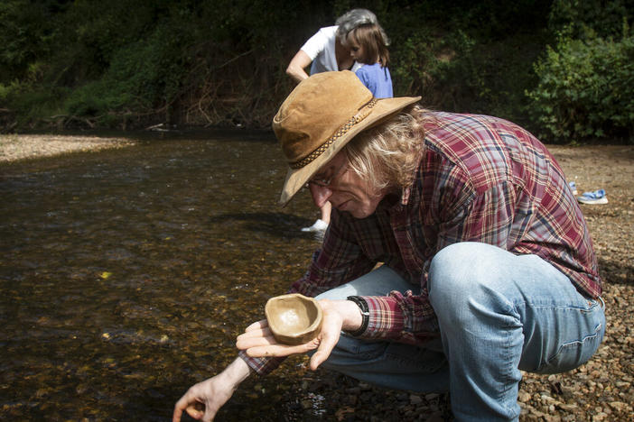 Jonathon Keats, an American conceptual artist, puts the finishing touches on a bowl made out of clay during a workshop on Saturday, Sept. 18, 2021, in Atlanta. Keats is in the process of devising a municipal clock to be located in Atlanta which would display time based on the flow rate of local rivers and waterways. Keats envisions the project as a way for people to have a closer connection with their natural surroundings.