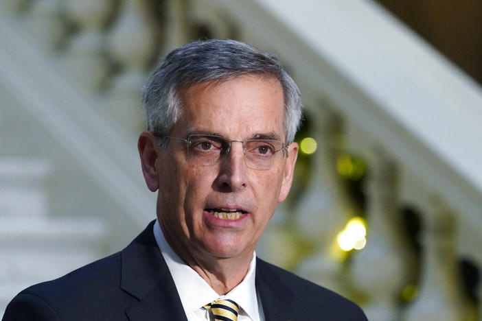 In this Dec. 14, 2020 file photo, Georgia Secretary of State Brad Raffensperger speaks during a news conference in Atlanta. As former President Donald Trump sought to lay blame for his 2020 election loss, Georgia’s secretary of state emerged as one of his main targets. Now, with a Trump-endorsed challenger in the Republican primary, Brad Raffensperger is in a tough fight to keep his job.