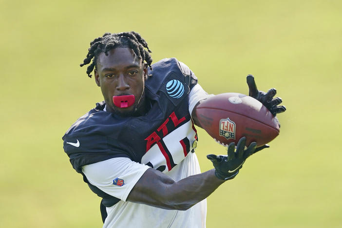 Atlanta Falcons wide receiver Calvin Ridley (18) makes a catch during the team's NFL training camp football practice Monday, Aug. 9, 2021, in Flowery Branch, Ga. Falcons wide receiver Calvin Ridley has been suspended for the 2022 season for betting on NFL games in the 2021 season. The suspension announced by NFL commissioner Roger Goodell on Monday, March 7, 2022, is for activity that took place while Ridley was away from the team while addressing mental health concerns.