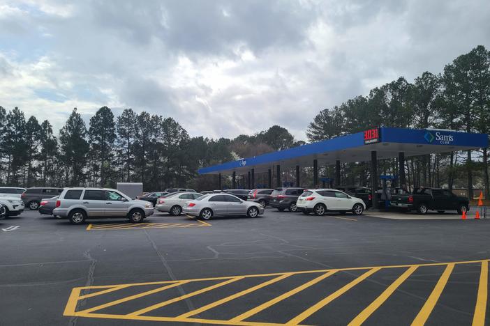 Cars wait in long line to purchase discounted gas at a Sam's Club in Tucker, Georgia as gas prices around the country hit record highs.