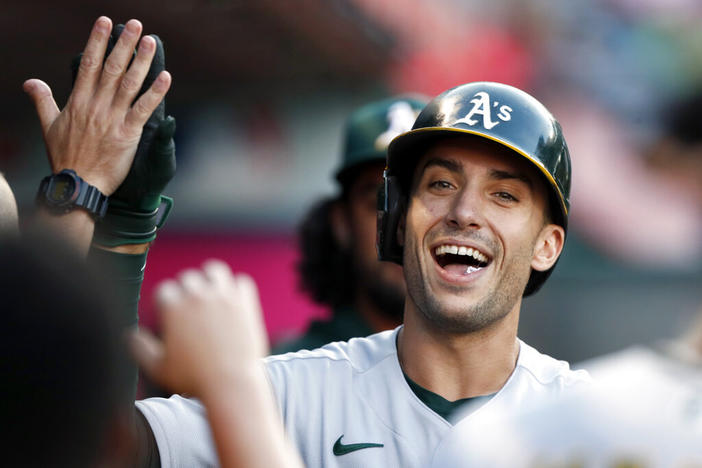 Oakland Athletics' Matt Olson gets congratulations from teammates after his solo home run against the Los Angeles Angels during the first inning of a baseball game in Anaheim, Calif., Saturday, Sept. 18, 2021. Freddie Freeman's tenure with the Atlanta Braves appears to be over after the World Series champions acquired All-Star first baseman Matt Olson from the Oakland Athletics on Monday, March 14, 2022.