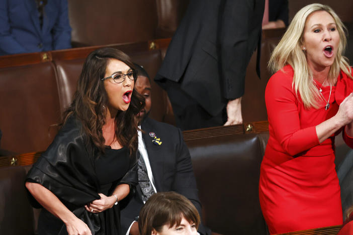 Rep. Lauren Boebert, R-Colo., left, and Rep. Marjorie Taylor Greene, R-Ga., right, scream "Build the Wall" as President Joe Biden delivers his first State of the Union address to a joint session of Congress at the Capitol, Tuesday, March 1, 2022, in Washington. 