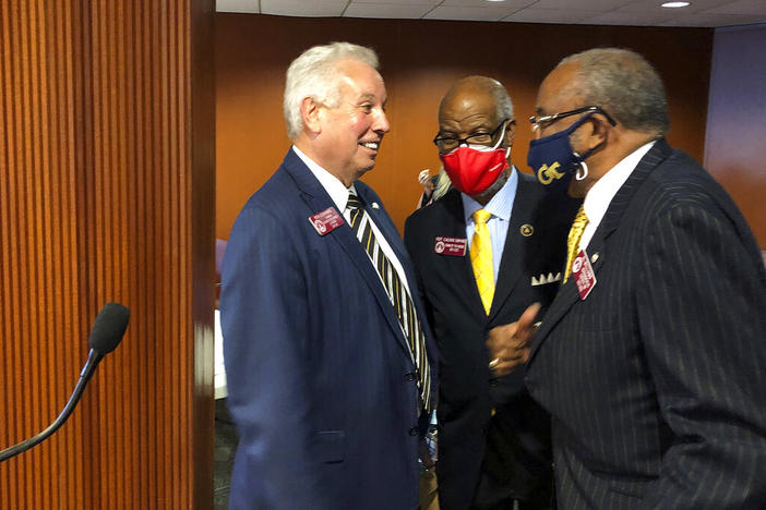 Georgia House Economic Development and Tourism Committee Chairman Ron Stephens, left, a Savannah Republican, talks to Democratic state Reps. Calvin Smyre, center, of Columbus and Al Williams, of Midway, Tuesday, Feb. 2, 2021, in Atlanta. The committee on Monday, March 28, 2022, passed a proposed constitutional amendment to legalize gambling and a bill to regulate sports betting.