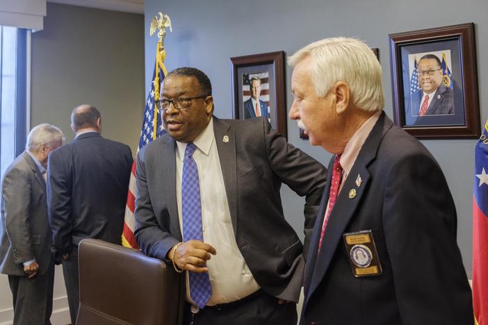 Georgia Department of Corrections Commissioner Timothy C. Ward, second from right, after the March meeting of the Board of Corrections in Forsyth. 