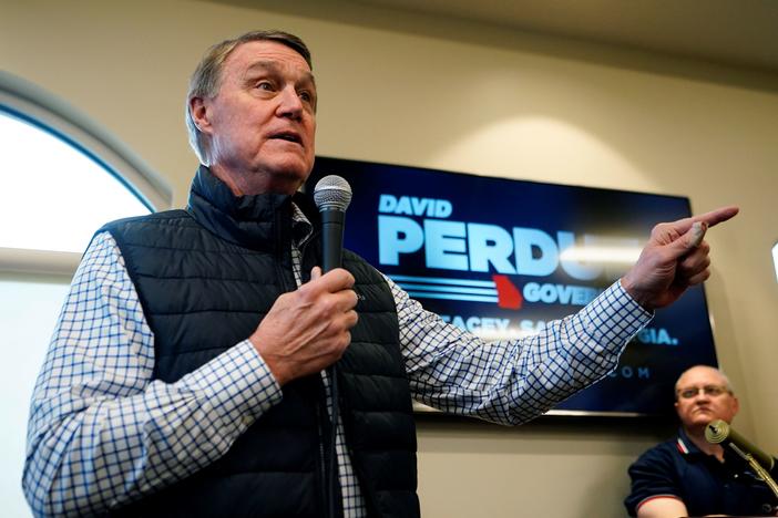 Republican candidate for Georgia governor former Sen. David Perdue arrives to speak at a campaign stop at the Covington airport on Feb. 2, 2022, in Covington, Ga.