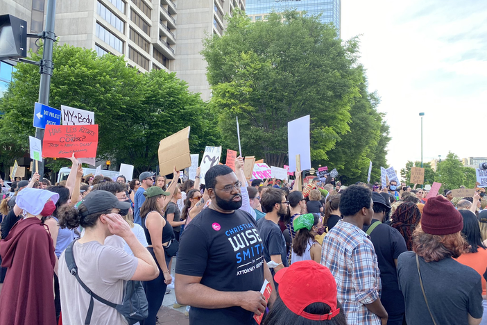 A crowd of a couple hundred people gathered at the intersection of Marietta Street and Centennial Olympic Park on May 3, 2022, to demonstrating in support of abortion access.