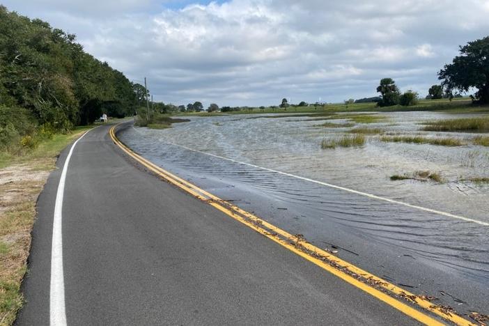 Flooding covers a road in coastal Brunswick.