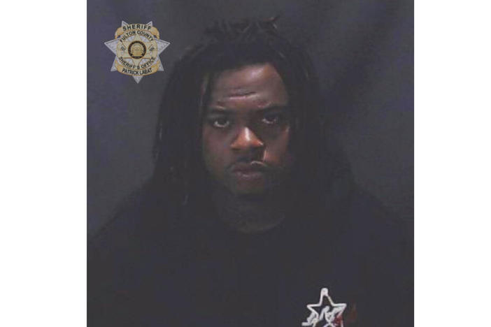 This image provided by the Fulton County Sheriff's Office shows rapper Gunna, whose given name is Sergio Kitchens. Rapper Gunna was booked into a jail in Atlanta Wednesday, May 11, 2022 on a racketeering charge after he was indicted with fellow rapper Young Thug and more than two dozen other people. An indictment filed Monday in Fulton County Superior Court accuses him of violating Georgia's anti-racketeering law. It was not immediately clear whether he had a lawyer who could comment on the charges.
