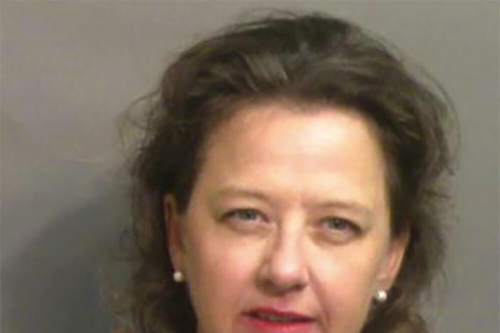 This jail booking photo provided by Glynn County Sheriff's Office, shows Jackie Johnson, the former district attorney for Georgia's Brunswick Judicial Circuit, after she turned herself in to the Glynn County jail in Brunswick, Ga, on Wednesday, Sept. 8, 2021.