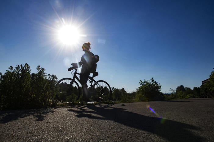 Gregory Matarazzo takes a break from cycling as the temperatures hovered over 100 degrees in Missoula, Montana, on Wednesday, June 30, 2021.