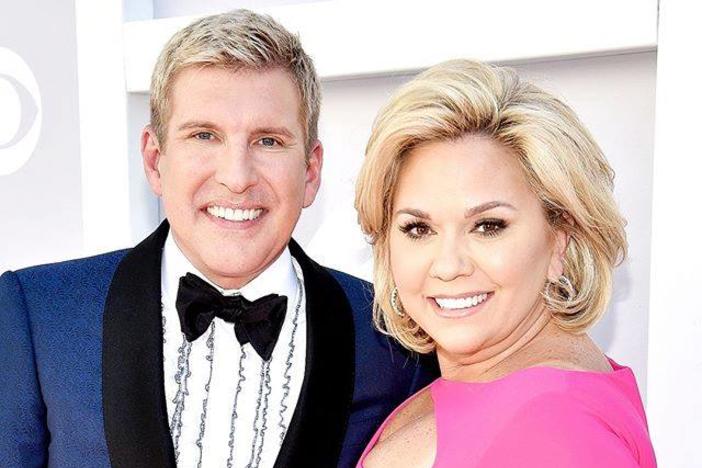 Todd Chrisley, left, and his wife, Julie Chrisley, pose for photos at the 52nd annual Academy of Country Music Awards on April 2, 2017, in Las Vegas. The couple, stars of the reality television show “Chrisley Knows Best,” have been found guilty in Atlanta on federal charges including bank fraud and tax evasion Tuesday, June 7, 2022.