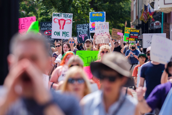 Hundreds attended a rally Sunday in Macon in protest of the overturning of Roe v. Wade. After a brief march, attendees, one after the other, shared their stories of abortion, access and choice.