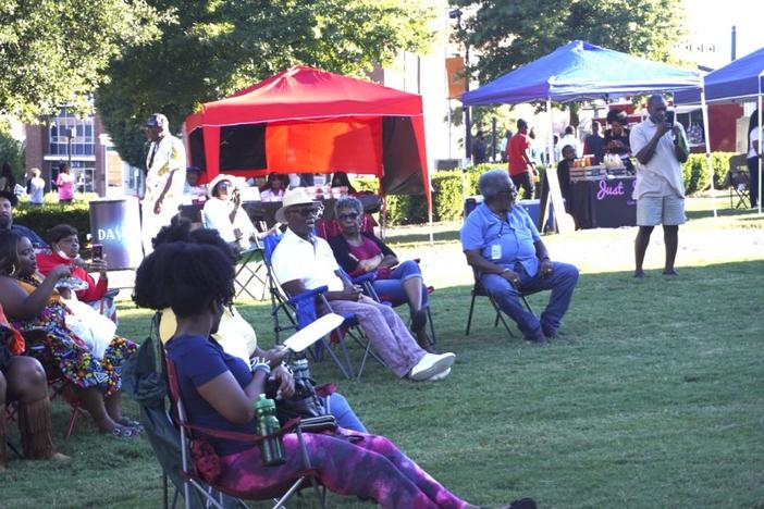 Women sitting in lawn chairs