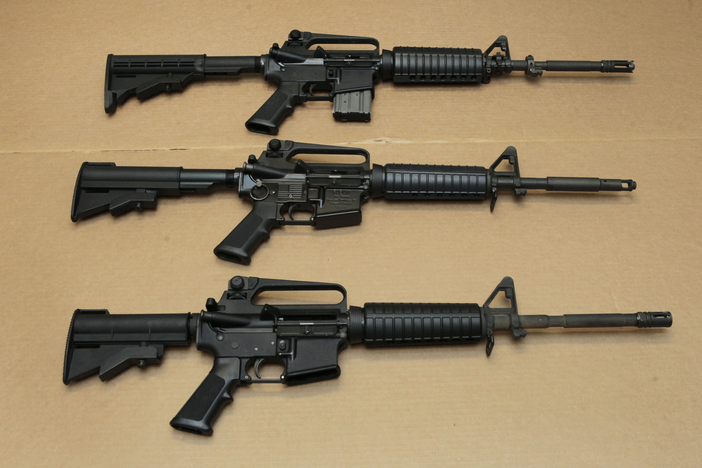 Three AR-15 rifles. 