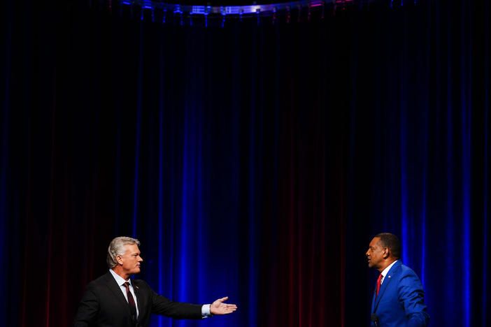 Mike Collins, left, and Vernon Jones participate in Georgia's 10th Congressional District republican primary election runoff debates on Monday, June 6, 2022, in Atlanta. 
