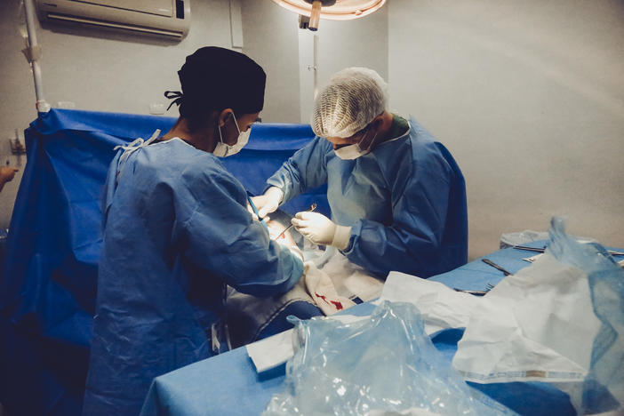 Doctor performing surgery
