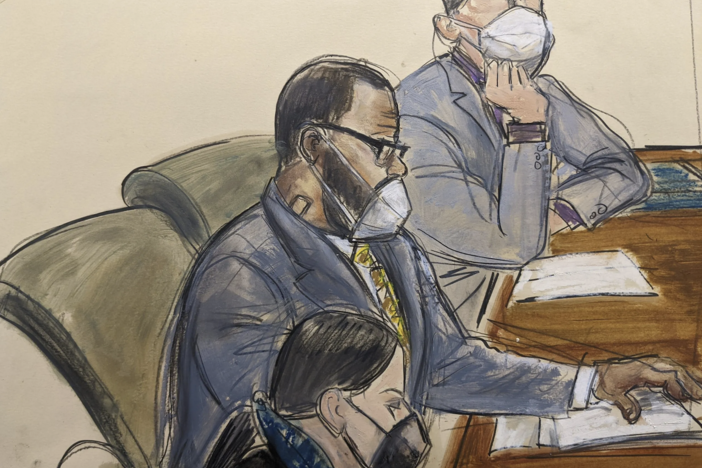 In this courtroom sketch, R. Kelly, center, sits with his defense attorneys Thomas Farinella, top, and Nicole Blank Becker during the first day of his defense in his sex trafficking case, Monday, Sept. 20, 2021, in New York. The former R&B superstar was convicted of racketeering and other crimes. (AP Photo/Elizabeth Williams)