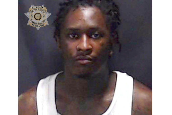 This booking photo provided by Fulton County Sheriff’s Office shows a booking photo of Atlanta rapper Young Thug. The Atlanta rapper, whose name is Jeffery Lamar Williams, was one of 28 people indicted Monday, May 9, 2022, in Georgia on conspiracy to violate the state's RICO act and street gang charges, according to jail records.