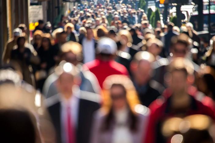 Crowd walking down street