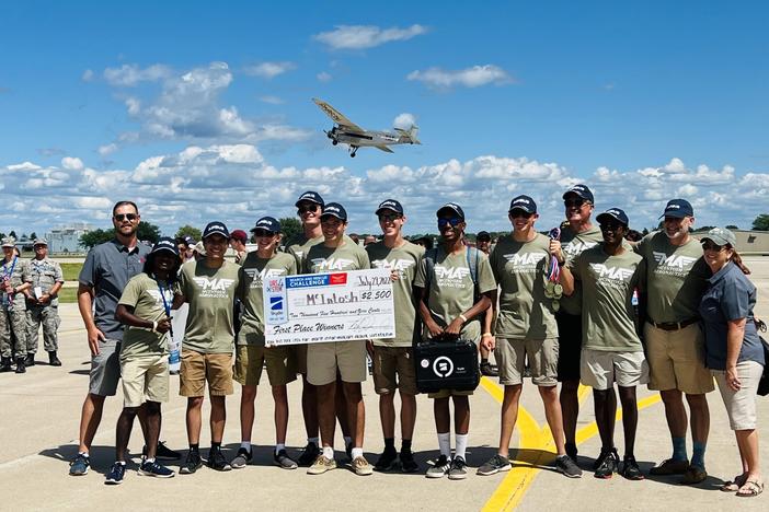 McIntosh Aeronautics hold up their first place prize.