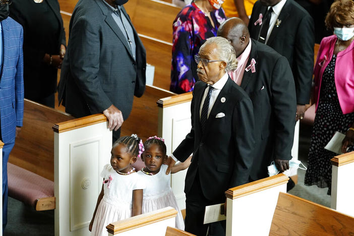 Rev. Al Sharpton at a funeral service for Brianna Grier with her twin three-year-old daughters Thursday, Aug. 11, 2022, in Atlanta. The 28-year-old Georgia woman died after she fell from a moving patrol car following her arrest.