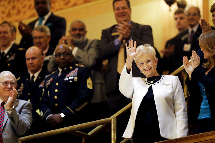Sandra Deal waves as she is acknowledged by a round of applause before the State of the State address by her husband, Georgia Gov. Nathan Deal, on the House floor in Atlanta on Jan. 11, 2017. Sandra Deal died from brain cancer on Tuesday, Aug. 23, 2022, at age 80 at her home in Demorest, Ga. (AP Photo/David Goldman, File)