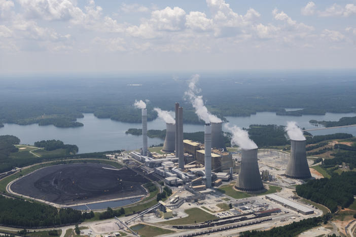 Front end loaders are dwarfed by the coal field at Georgia Power's Plant Scherer.