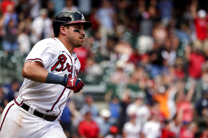 Atlanta Braves' Austin Riley runs to first on a game winning RBI during the ninth inning of a baseball game against the Arizona Diamondbacks, Sunday, July 31, 2022, in Atlanta.