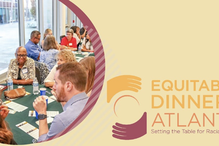 People having conversation around a table 