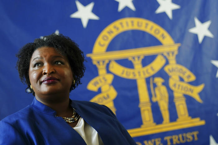 Democratic candidate for Georgia Governor Stacey Abrams poses for a portrait in front of the State Seal of Georgia Monday, Aug. 8, 2022, in Decatur, Ga.