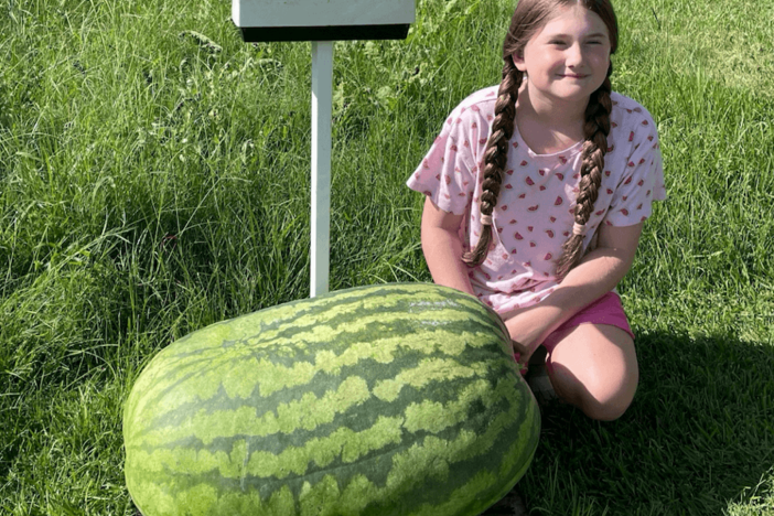 Madelynn Murphy, fourth grade 4-H’er from Appling County, poses with her first-place winning 109-pound watermelon.