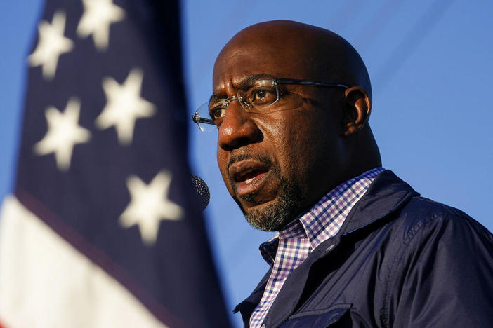 In this Nov. 15, 2020, file photo Raphael Warnock, a Democratic candidate for the U.S. Senate, speaks during a campaign rally in Marietta, Ga. As the head of the Atlanta church where Martin Luther King Jr. preached, Warnock has not shied away from impassioned sermons and forceful advocacy on behalf of the poor and disadvantaged. The 51-year-old now wants to take that progressive platform to the U.S. Senate. He is running to unseat one of Georgia's Republican senators, Kelly L