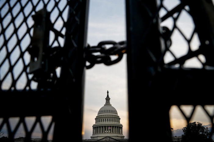 The capitol building behind a locked gate.