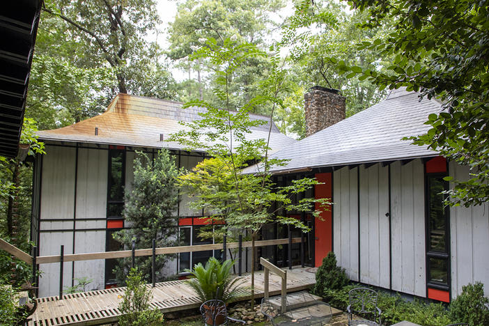 The home has a sunken courtyard in the front.