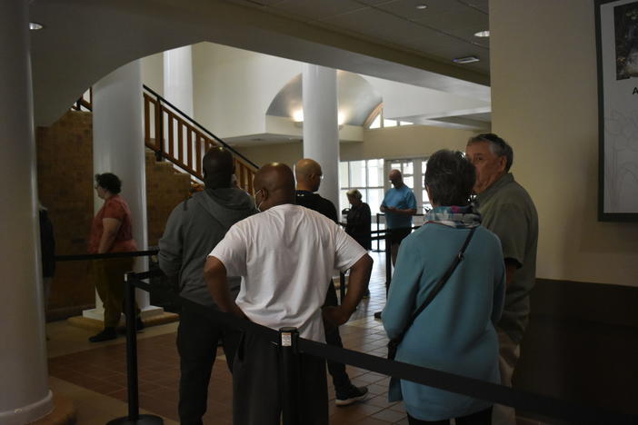 Voters line up inside the Smyrna Community Center for the first day of early voting Oct. 17, 2022.