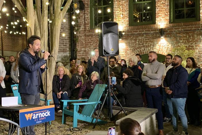 Lin-Manuel Miranda speaks at a campaign event for Sen. Raphael Warnock on Oct. 19, 2022