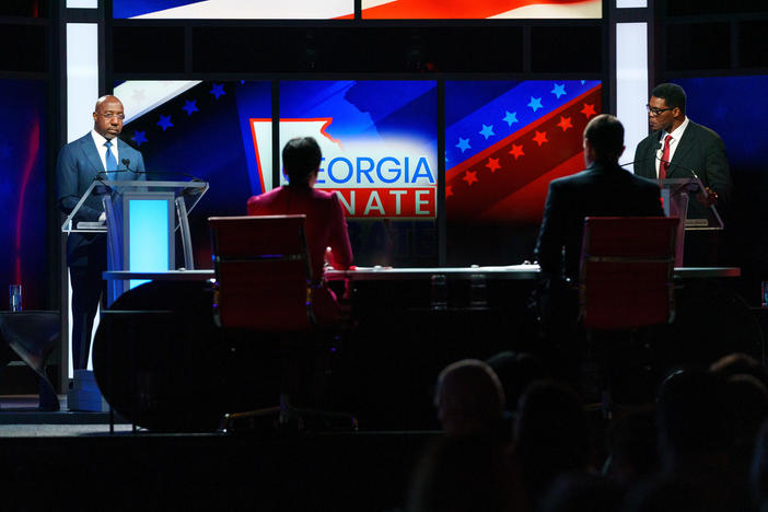 Sen. Raphael Warnock and Herschel Walker appear at a debate in Savannah.