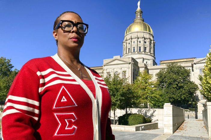 Rhonda Briggins, former co-chair of the Delta Sigma Theta National Social Action Commission and member of the sorority's Decatur alumnae chapter, poses for a photo at the state Capitol in Atlanta, Oct. 14, 2022, in Atlanta. Briggins spent the 2020 election at an Atlanta polling place handing out water and snacks to encourage voters to stay in an hours-long line to cast their ballot, something her historic Black sorority has done for decades in Georgia.