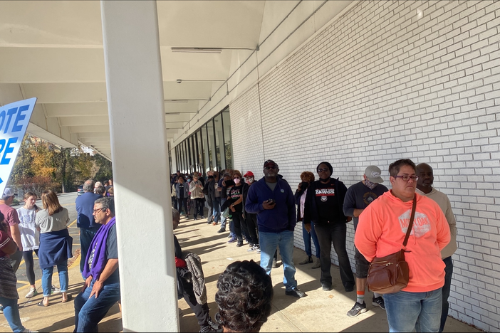 Voters in Dekalb County, Ga. wait in line at a polling place on Saturday, Nov. 26, 2022 to cast their ballots in the runoff election for U.S. Senate between incumbent Democratic Se. Raphael Warnock and Republican challenger Herschel Walker.