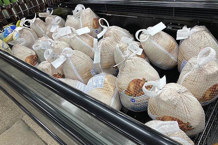 Hold For Biz—Frozen turkeys sit in a refrigerated case Wednesday, Nov. 17, 2021, inside a grocery store in southeast Denver.