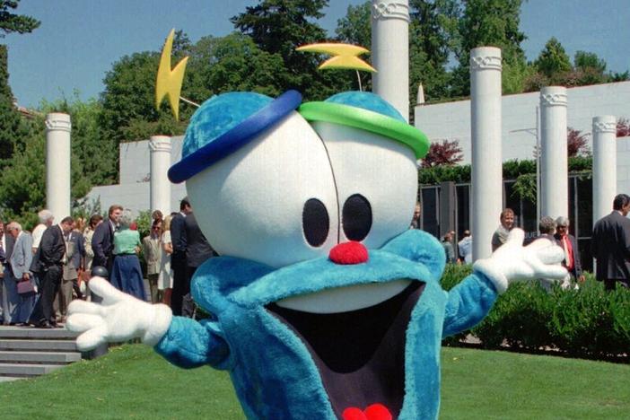 In this July 19, 1995, file photo, Izzy, the mascot of the Olympic Games of Atlanta 1996, dances in front of the Olympic Museum in Lausanne, Switzerland. The much-hated blob that represented the 1996 Atlanta Games has been supplanted by the mascot for the Paris Olympics — a Phrygian cap.