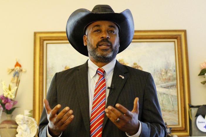 Marcus Flowers speaks at a campaign event in Acworth, Ga.