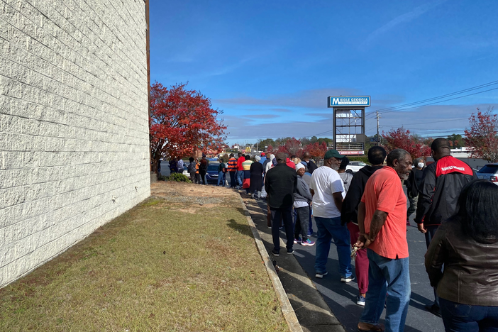 Voters in Bibb County, Ga. wait in line at a polling place on Saturday, Nov. 26, 2022 to cast their ballots in the runoff election for U.S. Senate between incumbent Democratic Se. Raphael Warnock and Republican challenger Herschel Walker.