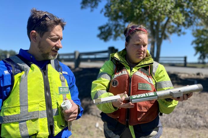 Chris Smith and Meghan Maylone from the U.S. Geological Survey collect a storm sensor from Skidaway Island near Savannah on Oct. 4, just days after Hurricane Ian wreaked havoc on parts of Florida and South Carolina. Georgia avoided a direct hit, but ripple effects along the coast were still felt.