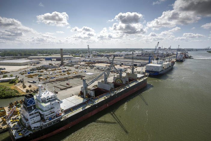 In this photo provided by the Georgia Ports Authority, three vessels work to load and unload cargo at the Georgia Ports Authority Ocean Terminal, June 24, 2022 in Savannah, Ga. On Monday, Dec. 5, 2022 the Georgia Ports Authority announced it will start remodeling the docks at Ocean Terminal in January 2023 to handle two large container ships simultaneously. The work will begin to transition the 200-acre facility to a container-only operation.